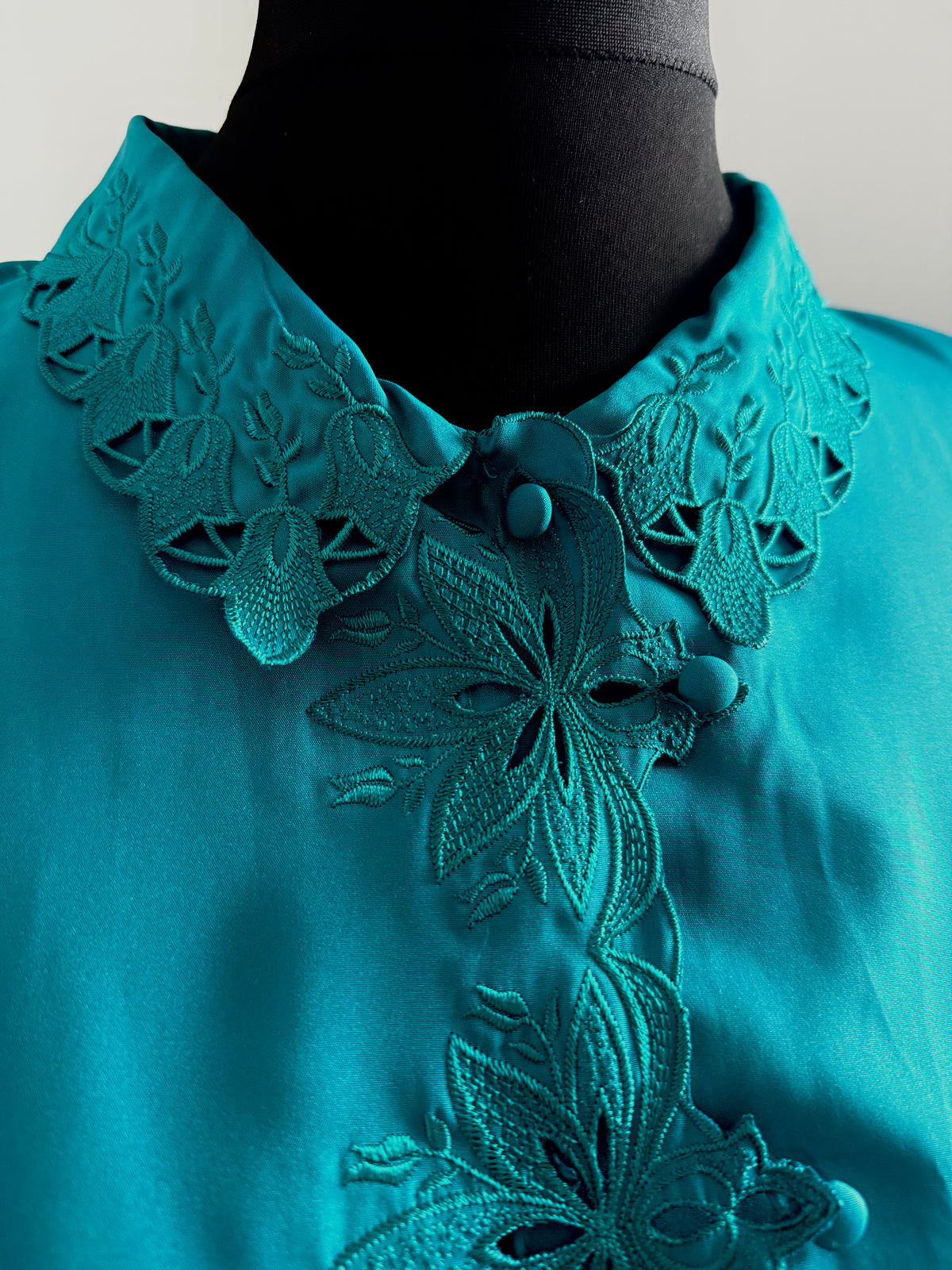 80s turquoise cut out detail blouse.