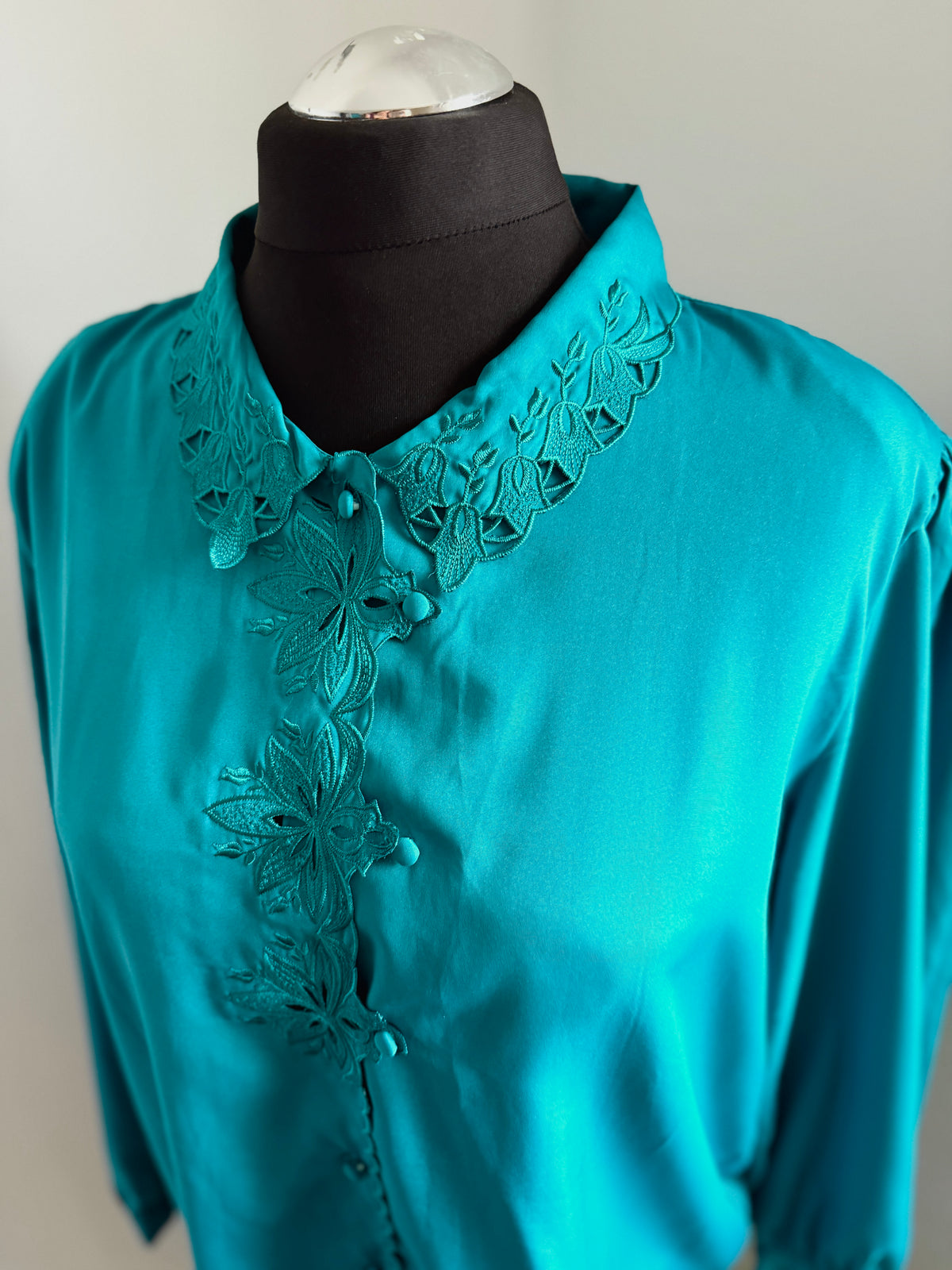 80s turquoise cut out detail blouse.