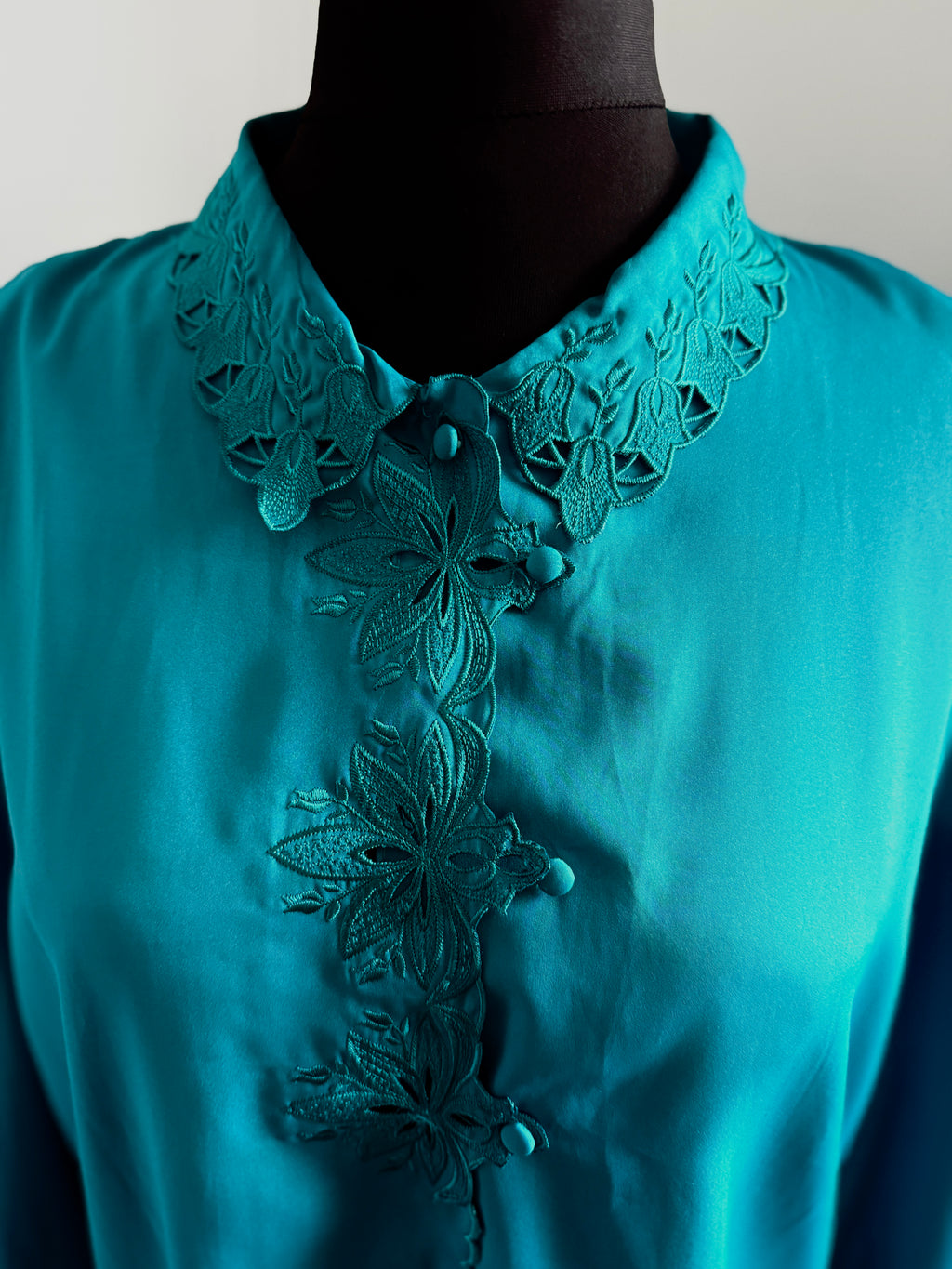 80s turquoise cut out detail blouse.