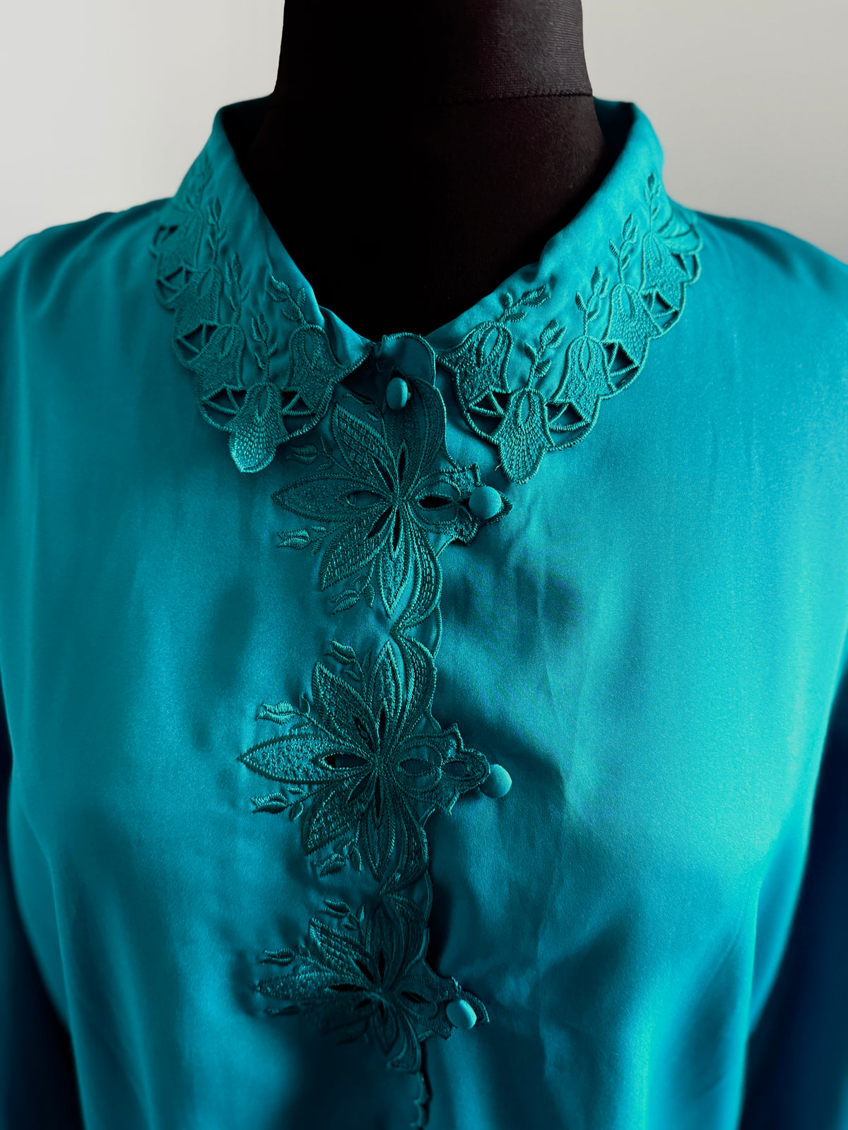 80s turquoise cut out detail blouse.